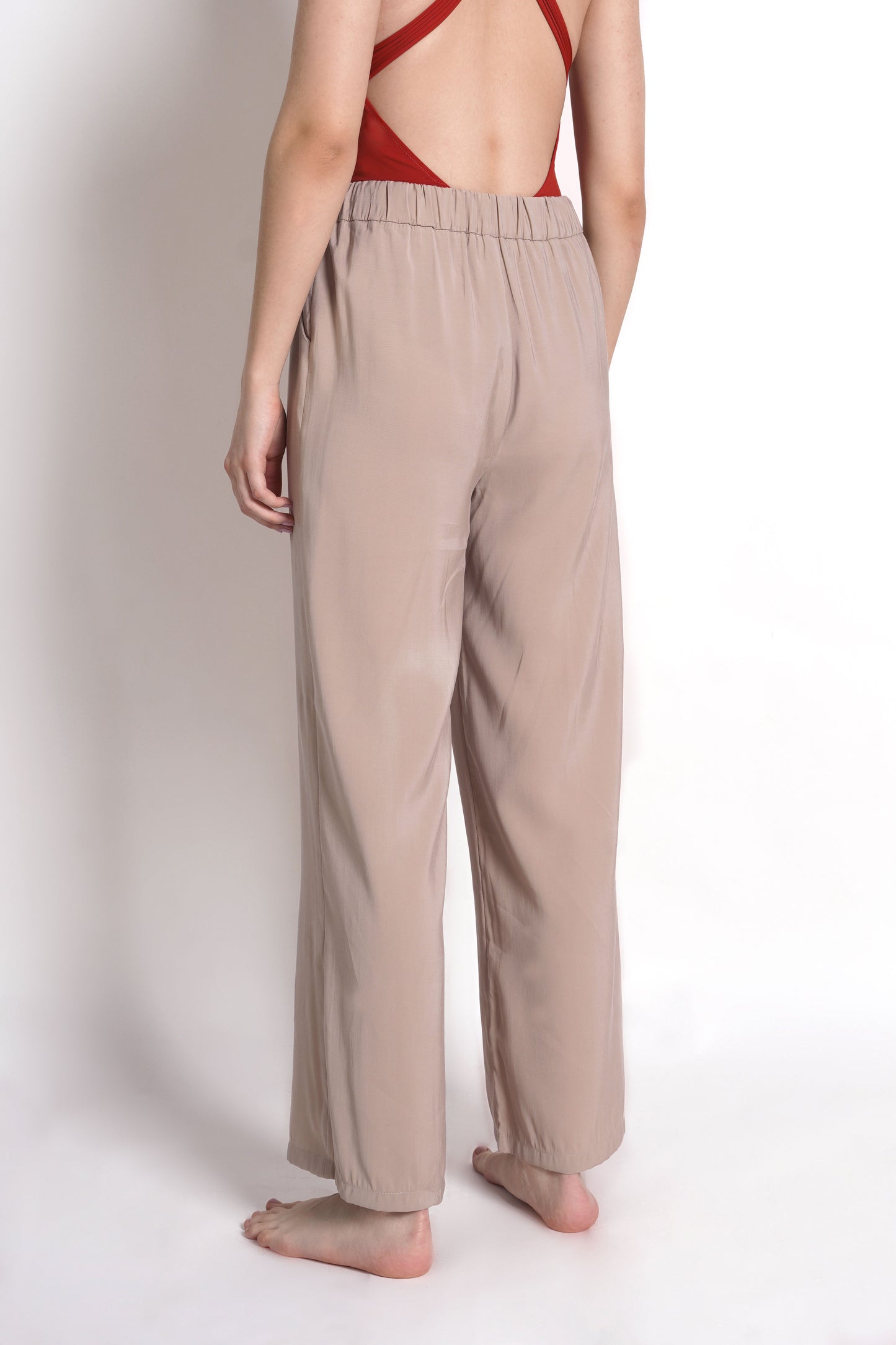 
                  
                    Straight-fit trousers with elasticated waistband
                  
                