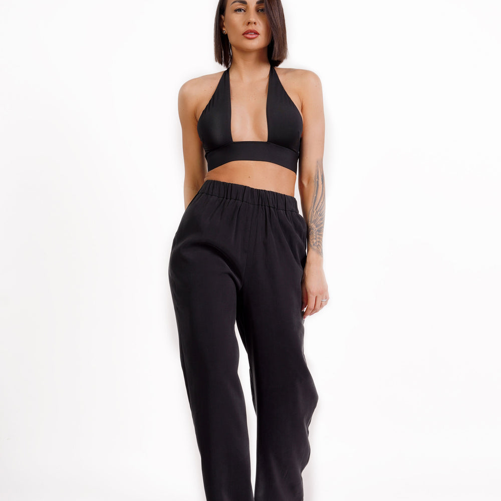 
                  
                    Straight-fit trousers with elasticated waistband
                  
                