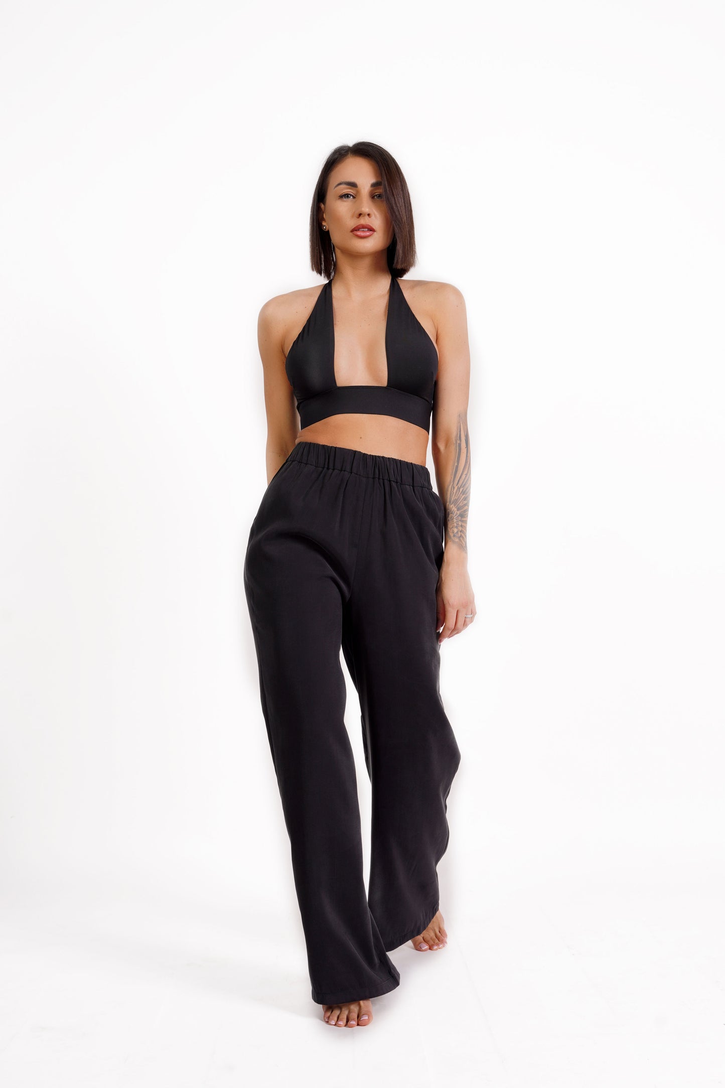 
                  
                    Straight-fit trousers with elasticated waistband
                  
                