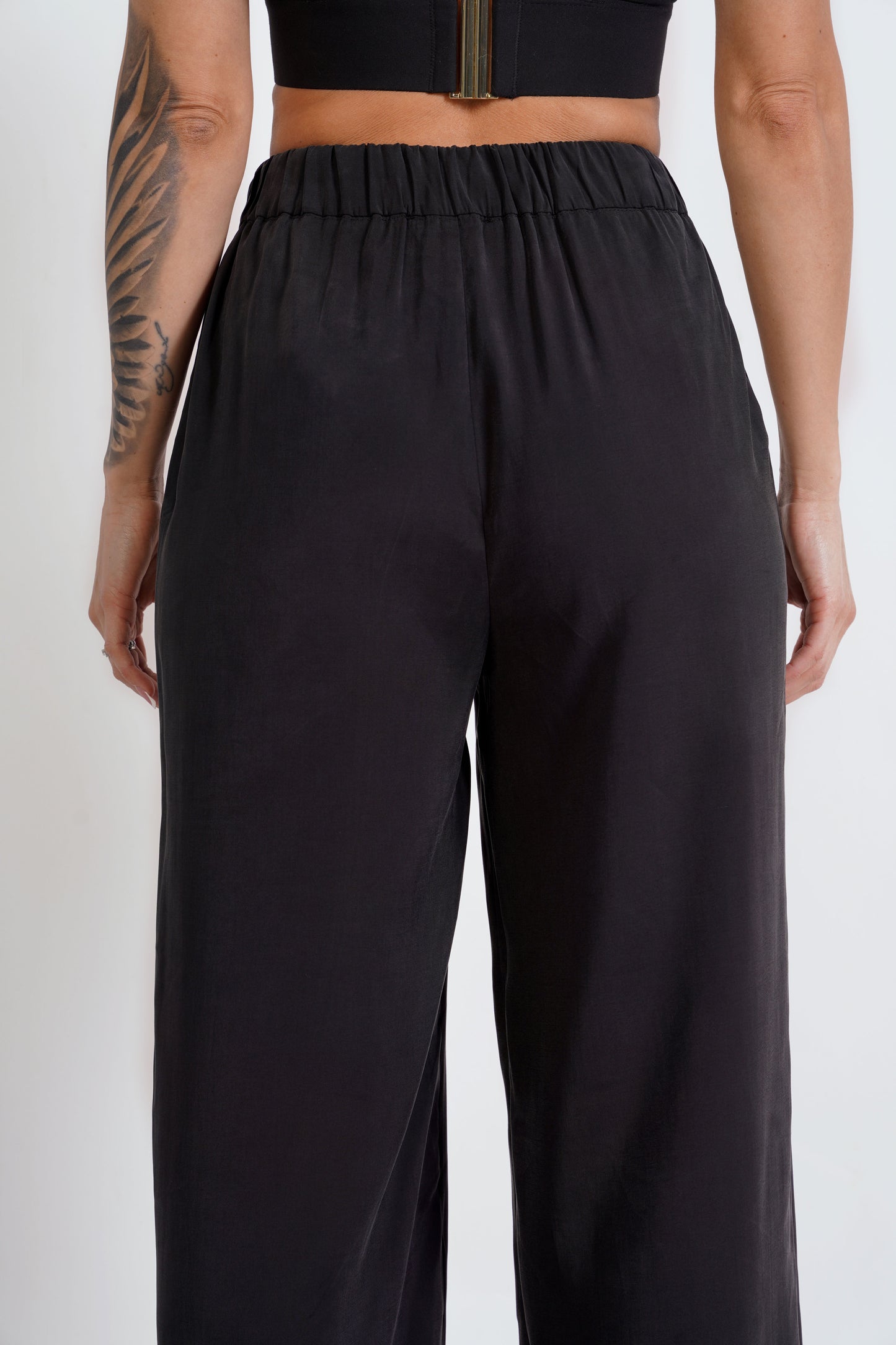 
                  
                    Straight-fit trousers with elasticated waistband
                  
                